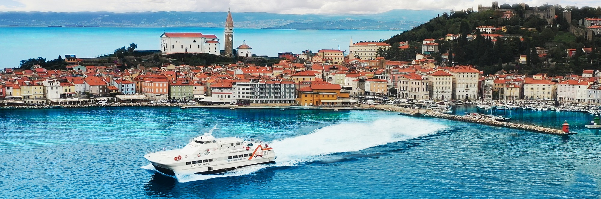 Catamaran leaving Piran